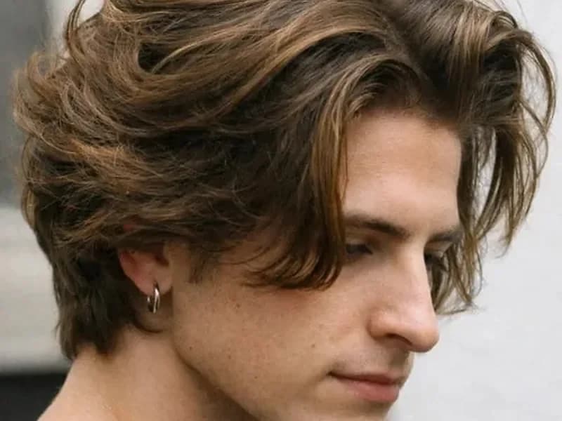 Medium length taper haircut for men in their 20s with natural texture