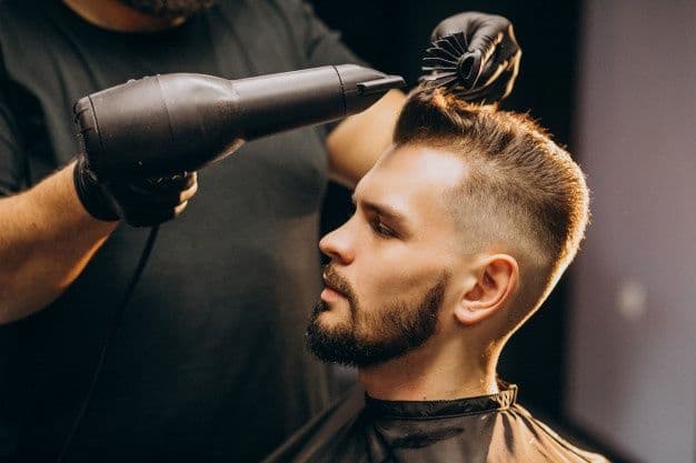 Professional fade with beard styling at Therapeutic Cuts barbershop Queens NYC