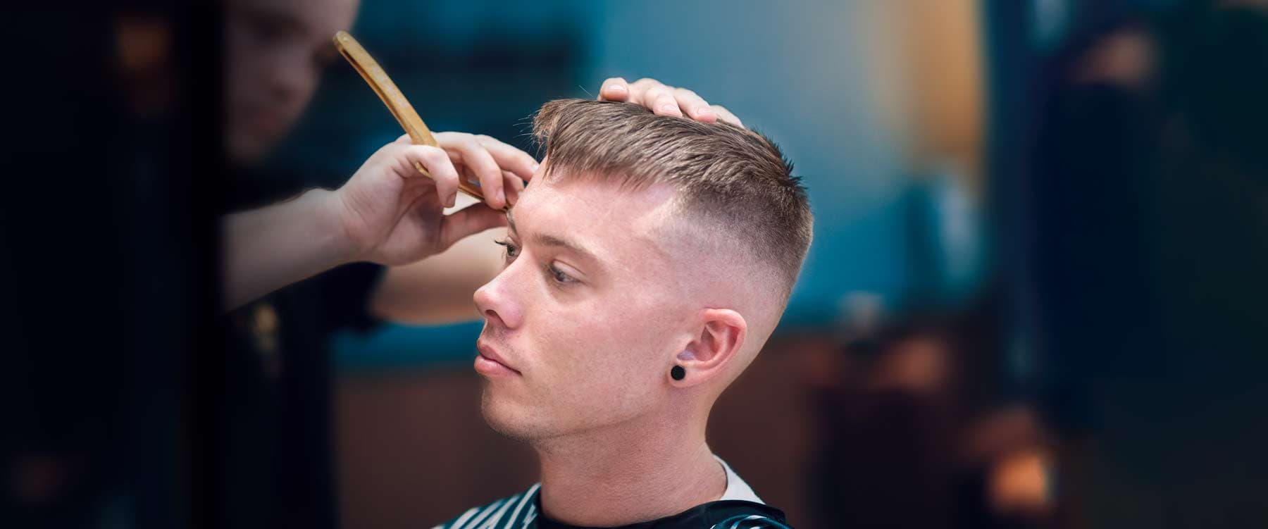 Professional fade with textured crop haircut at Therapeutic Cuts barbershop Queens NYC