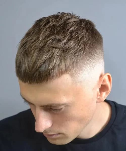 Textured crop with low fade for men with oblong face shapes in Queens