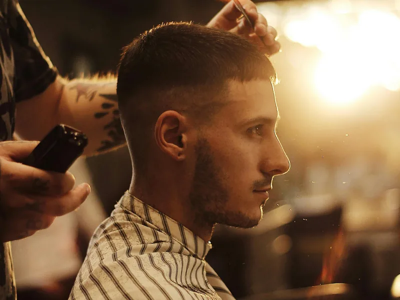 Precision clipper haircut showing balanced side profile for diamond face men