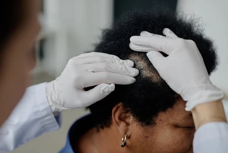 Professional scalp exam before quoting hair tattoo cost in NYC