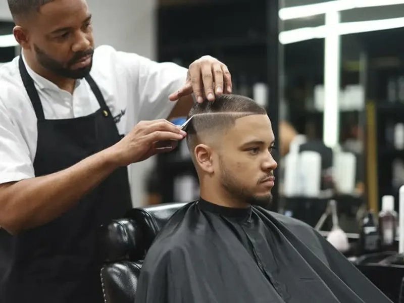 Short-sided haircut with beard shape for round face men