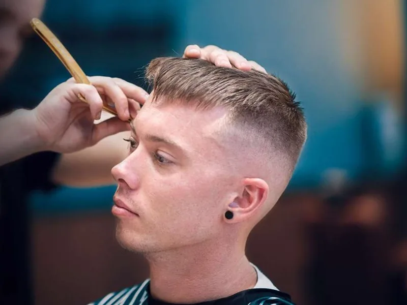 Skin fade textured crop haircut at a Queens barbershop